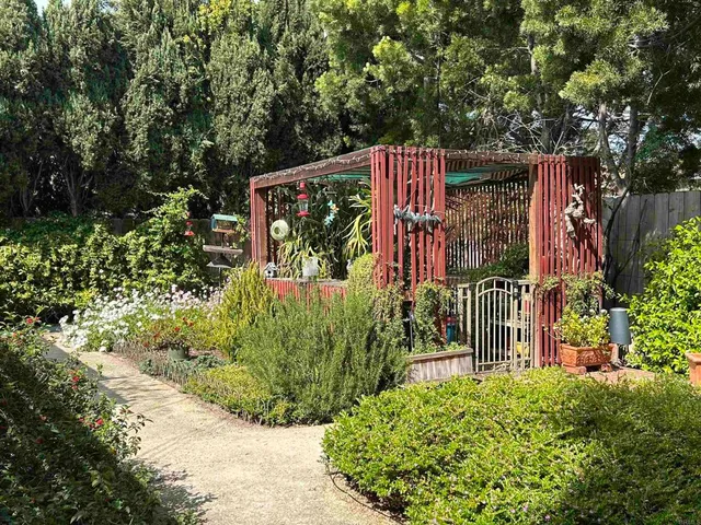 a backyard of a house with outdoor seating