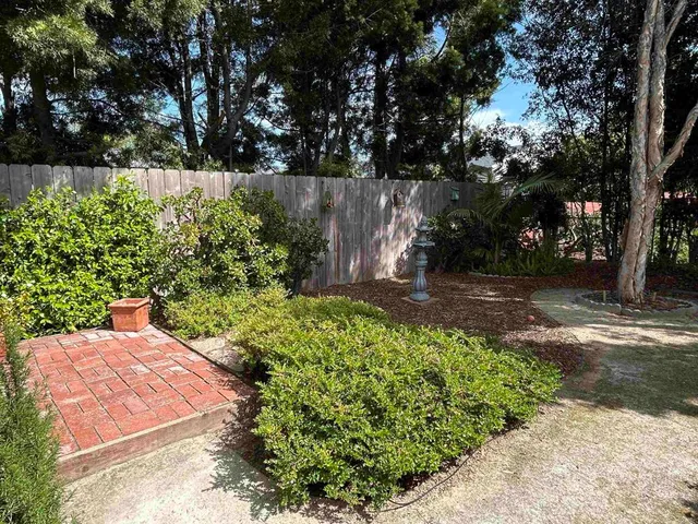 a outdoor living space with furniture and a potted plant