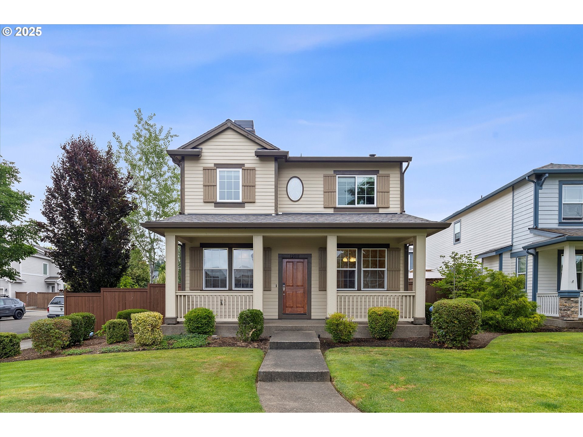 12001 Southwest Surrey Street Wilsonville, OR 97070 - Photo 2 of 48 a front view of a house with a yard