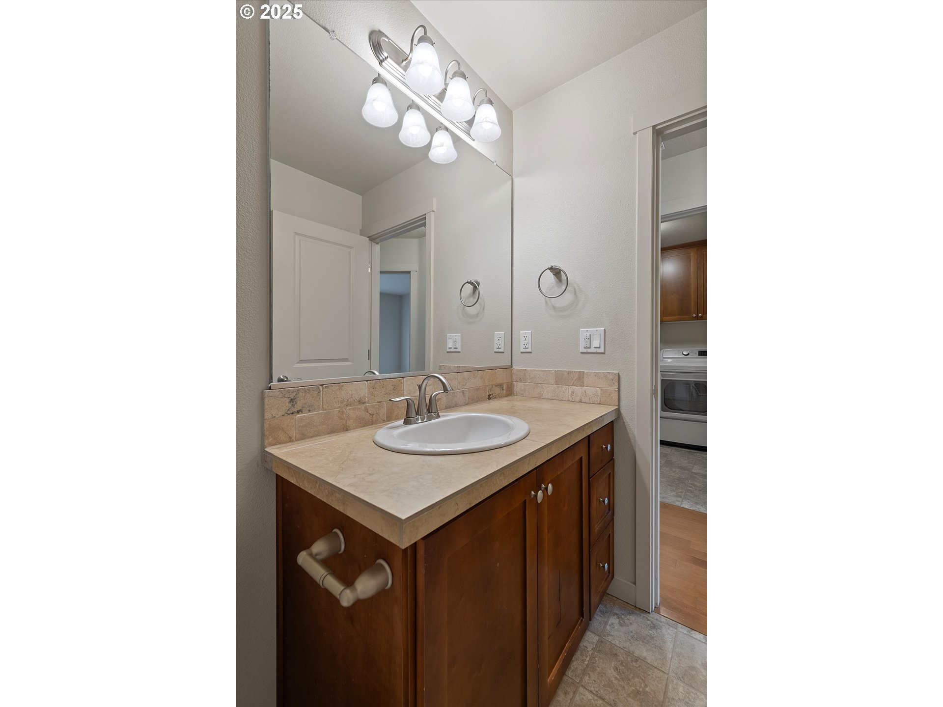12001 Southwest Surrey Street Wilsonville, OR 97070 - Photo 21 of 48 a bathroom with a sink and a mirror