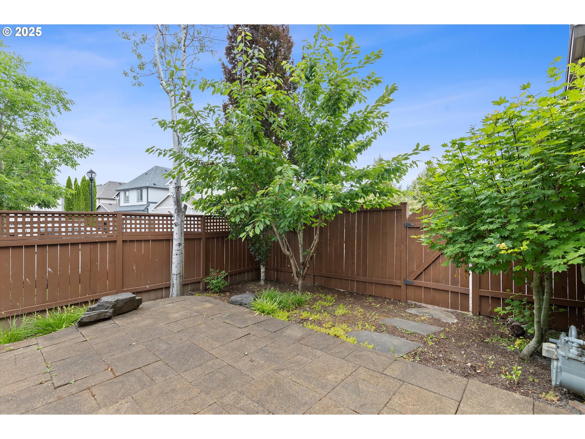 12001 Southwest Surrey Street Wilsonville, OR 97070 - Photo 29 of 48 a backyard of a house with lots of green space