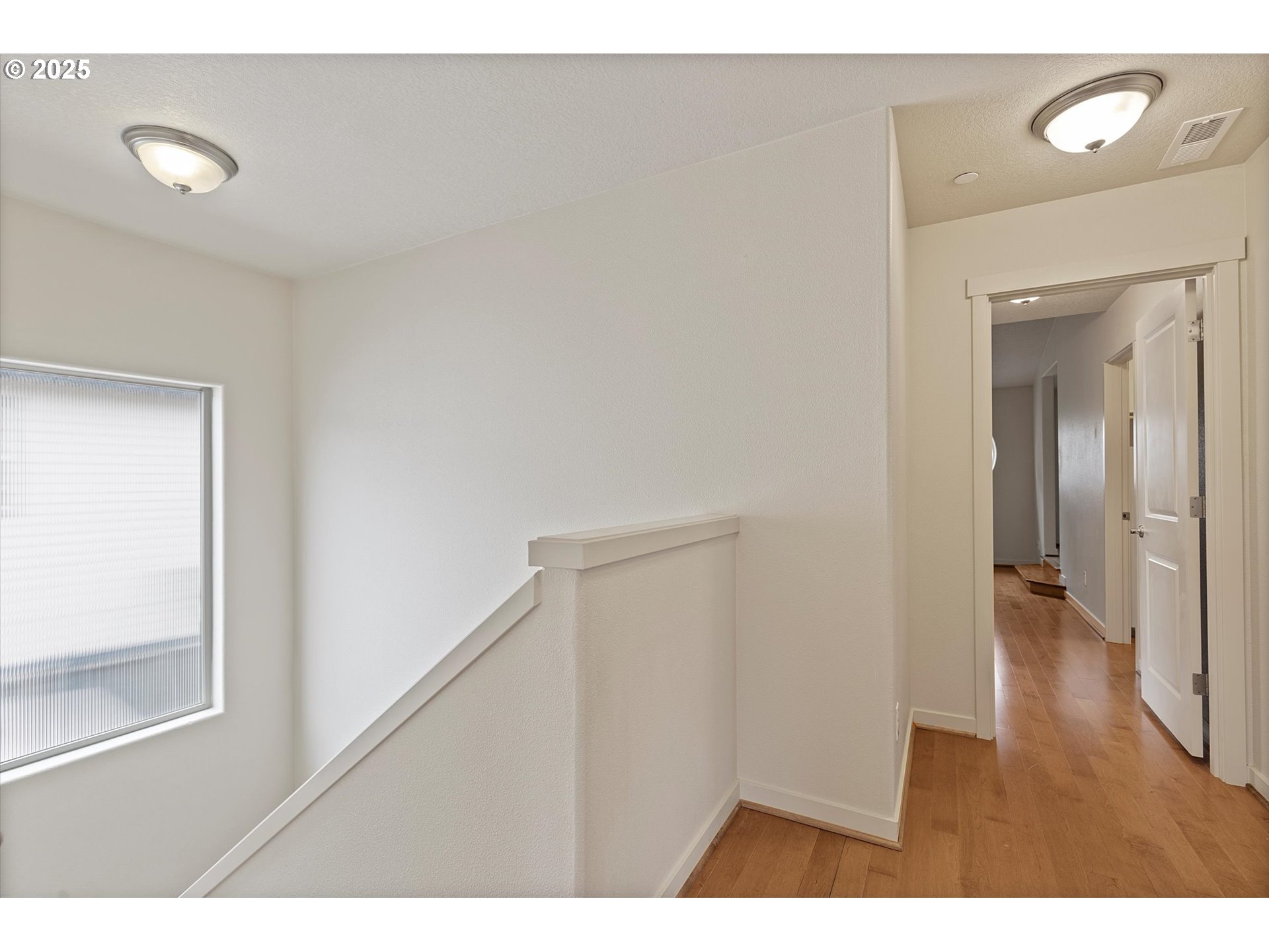 12001 Southwest Surrey Street Wilsonville, OR 97070 - Photo 31 of 48 a view of an empty room and wooden floor