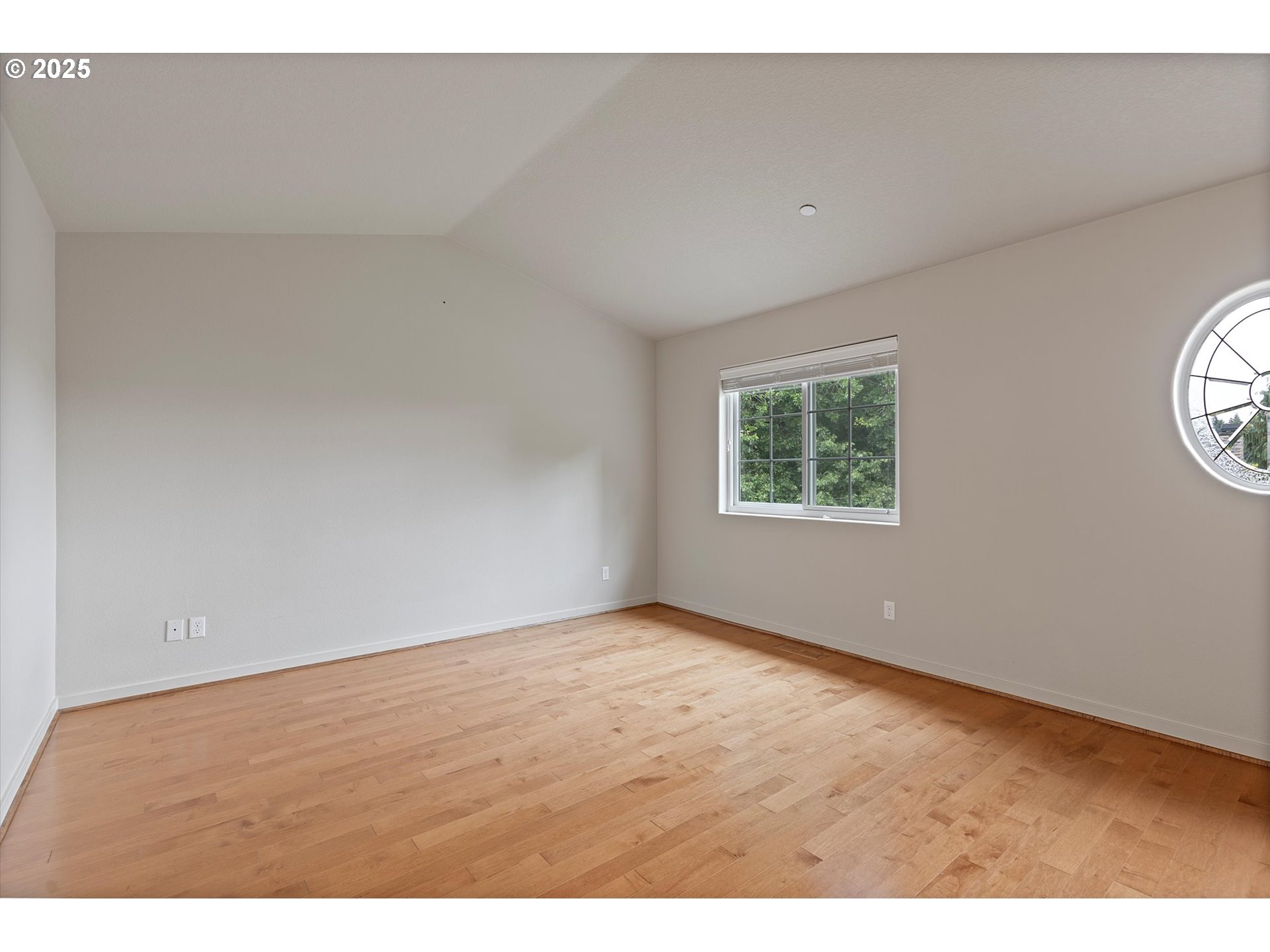 12001 Southwest Surrey Street Wilsonville, OR 97070 - Photo 32 of 48 an empty room with wooden floor and windows