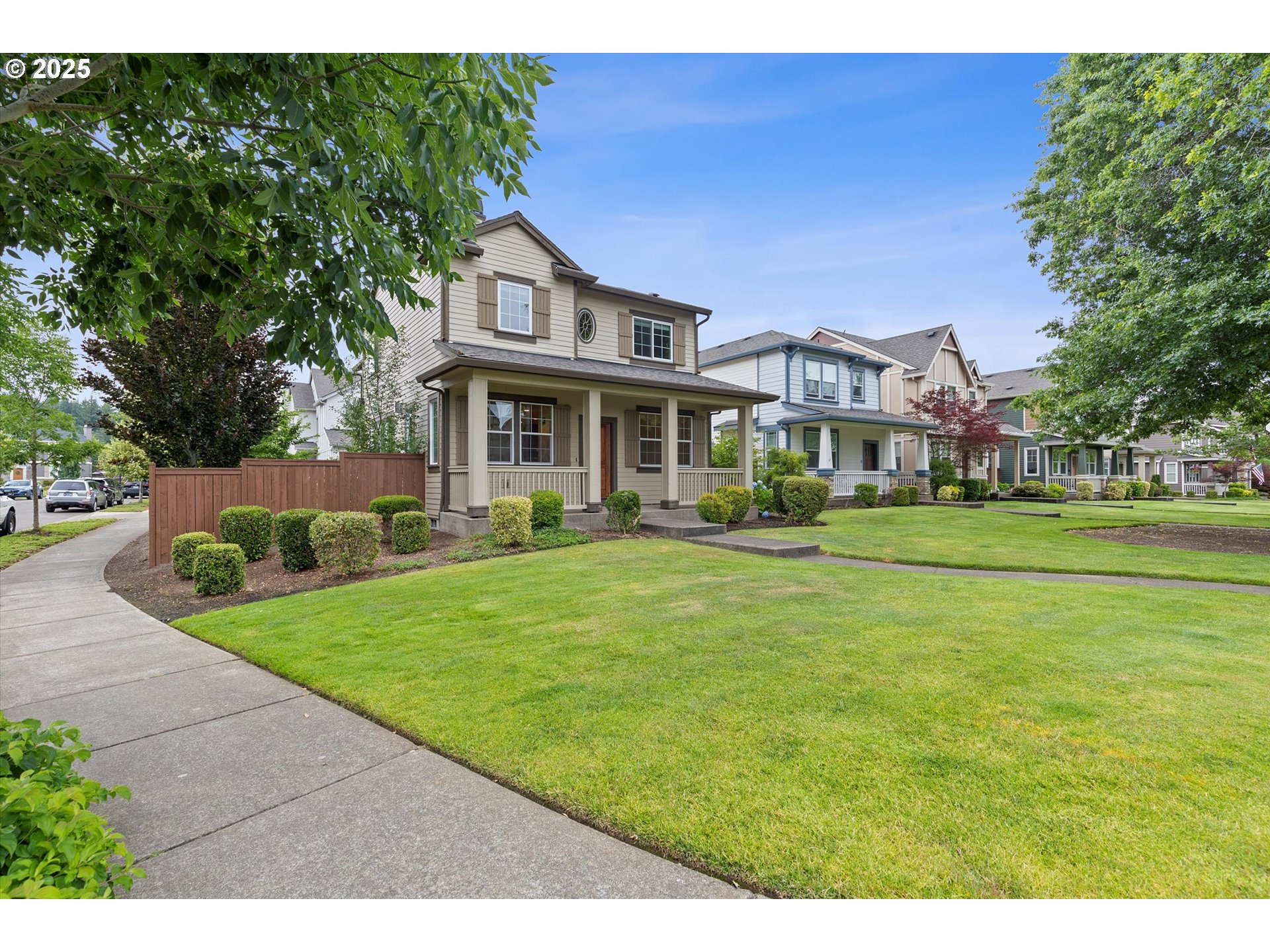 12001 Southwest Surrey Street Wilsonville, OR 97070 - Photo 6 of 48 a front view of a house with a garden
