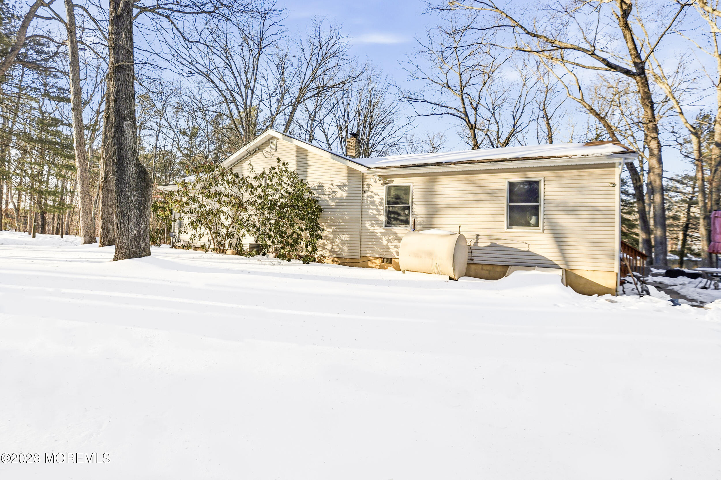 523 Cerrina Road Jackson, NJ 08527 - Photo 5 of 10 a view of a house with snow on the road