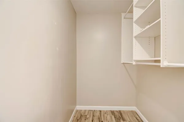 a view of a small space with racks on the wall