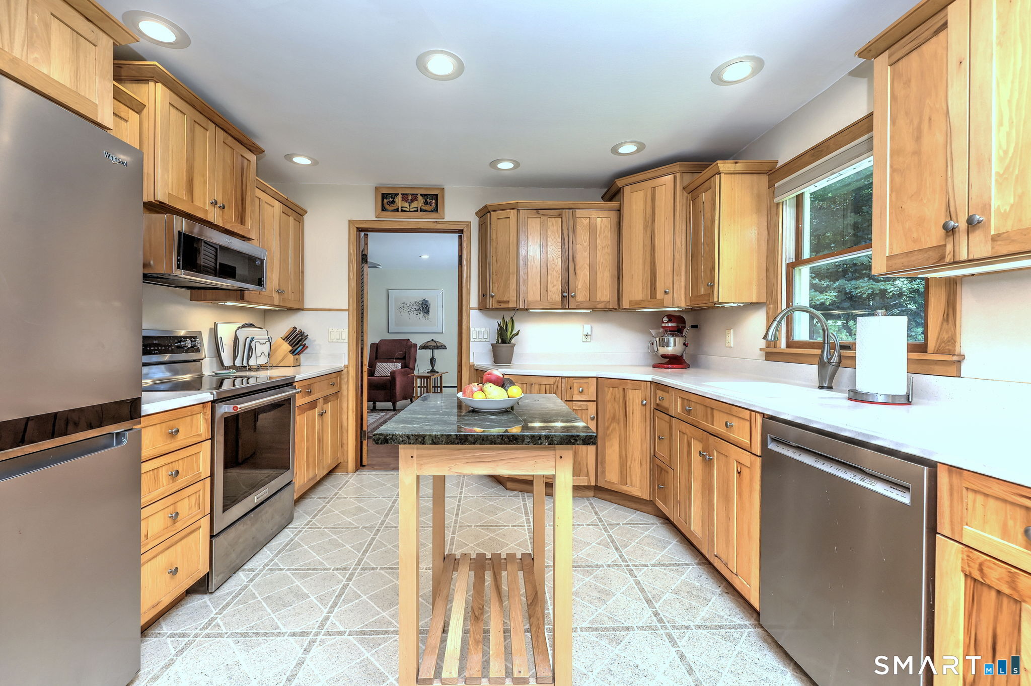 25 Mountain View Road Bethany, CT 06524 - Photo 9 of 27 Nice sized remodeled kitchen has beautiful custom made hickory cabinets, Corian counters and stainless steel appliances.