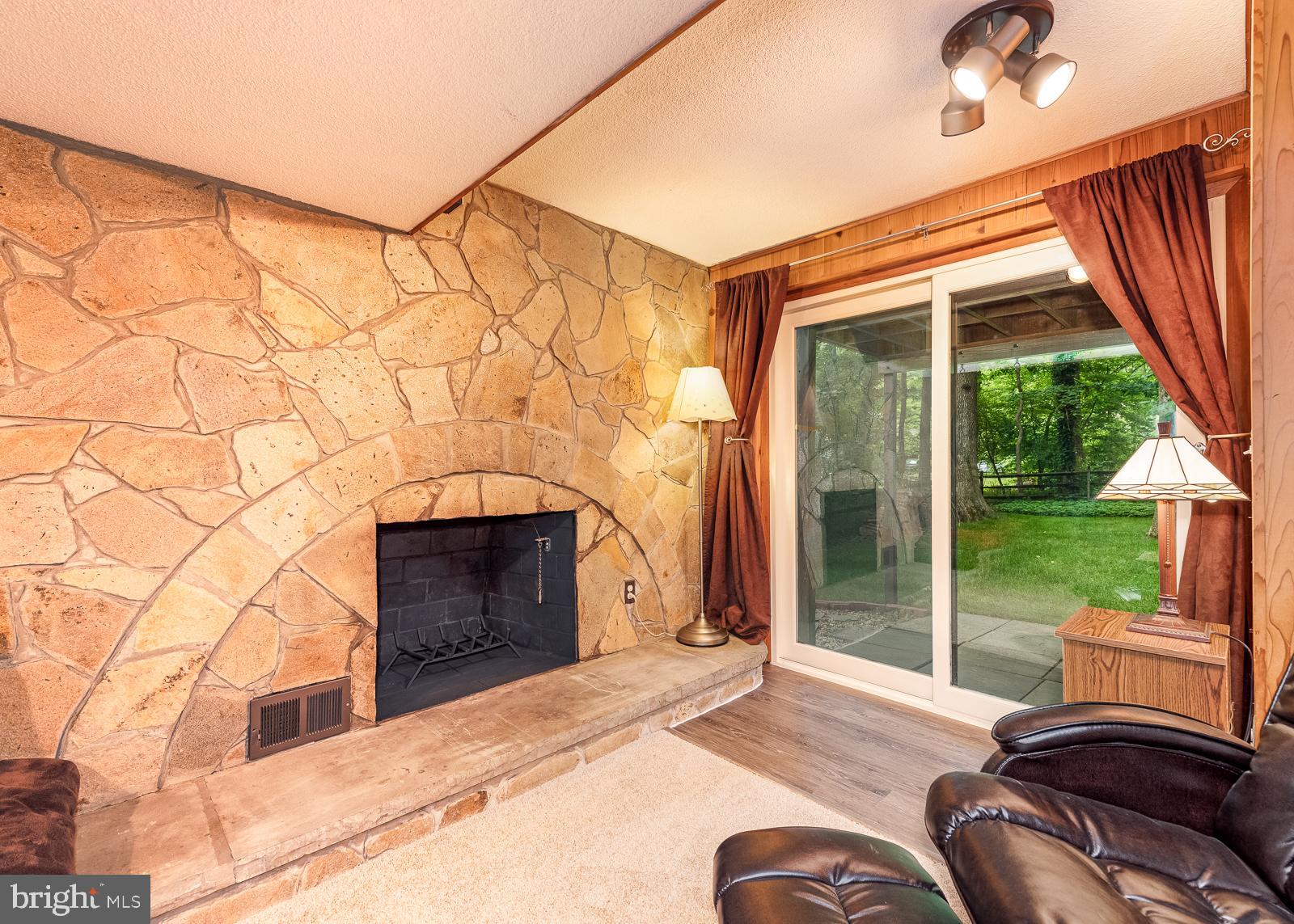 5405 Lightning View Road Columbia, MD 21045 - Photo 31 of 50 Gorgeous stone wall and fireplace