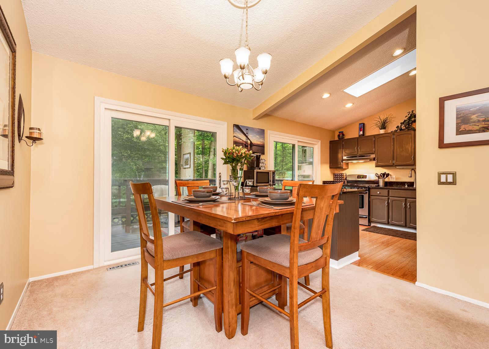 5405 Lightning View Road Columbia, MD 21045 - Photo 10 of 50 Dining and kitchen with double sliders to deck