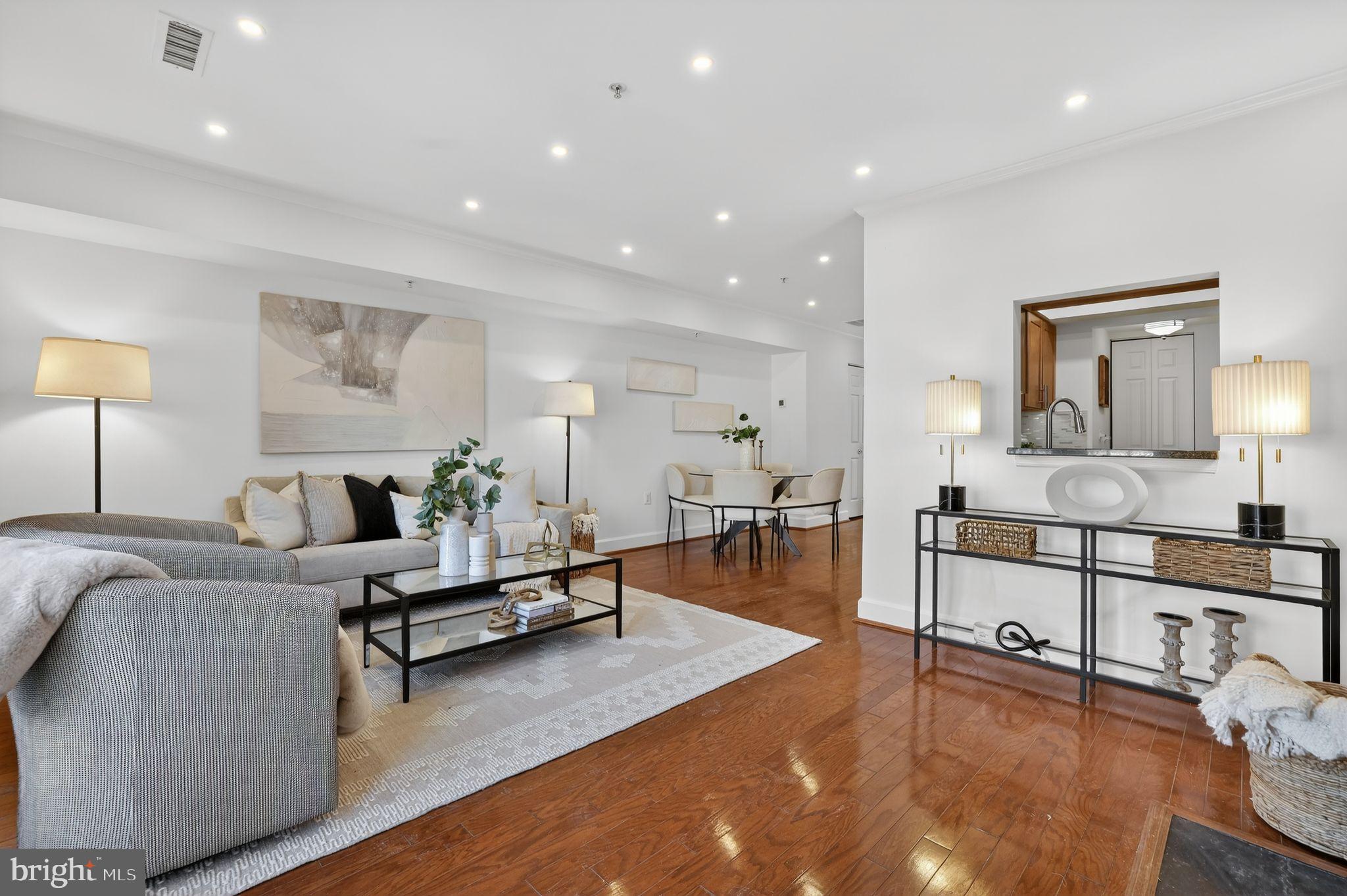 3805 Porter Street Northwest, Unit 201 Washington, DC 20016 - Photo 11 of 19 a living room with furniture and a table