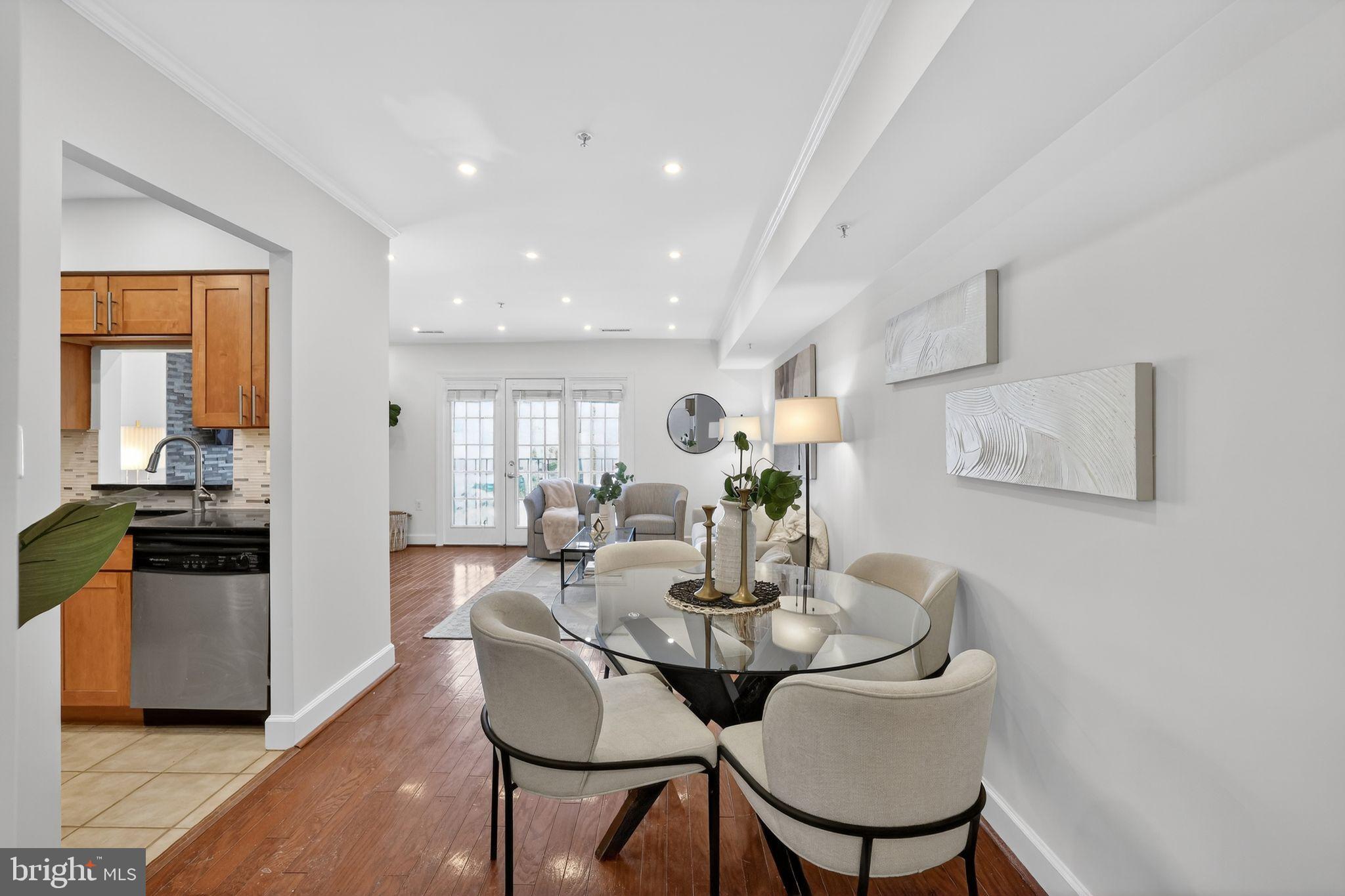 3805 Porter Street Northwest, Unit 201 Washington, DC 20016 - Photo 15 of 19 a view of a dining room with furniture