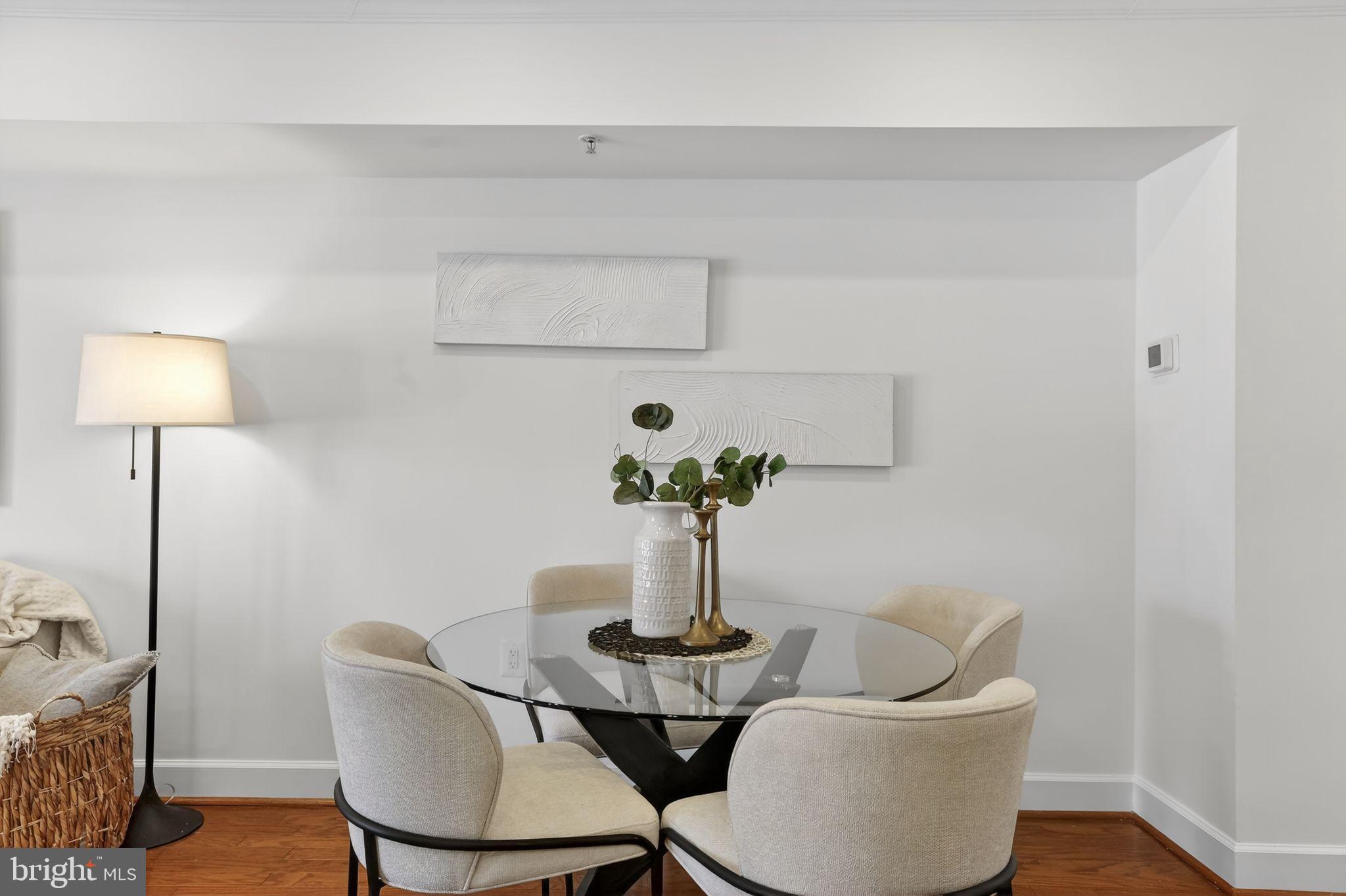 3805 Porter Street Northwest, Unit 201 Washington, DC 20016 - Photo 5 of 19 a living room with furniture and a lamp