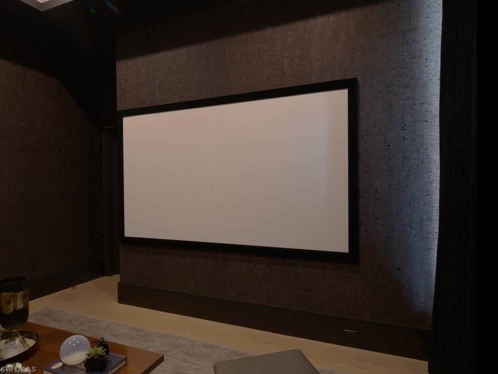 6199 Highcroft Drive Naples, FL 34119 - Photo 29 of 45 Home theater featuring projection screen, and black out curtains