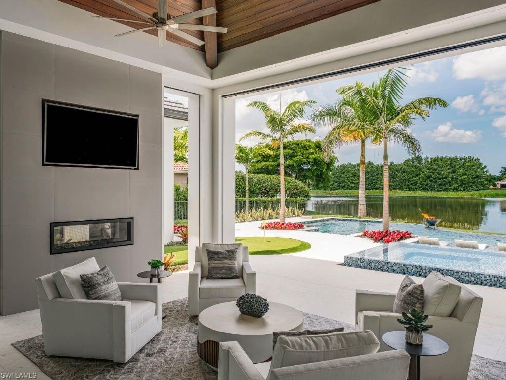6199 Highcroft Drive Naples, FL 34119 - Photo 38 of 45 Outdoor living room with views of the lake the 11th tee box of the Lakes course