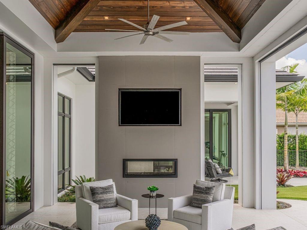 6199 Highcroft Drive Naples, FL 34119 - Photo 39 of 45 Outdoor living room with ceiling fan and outdoor lounge area