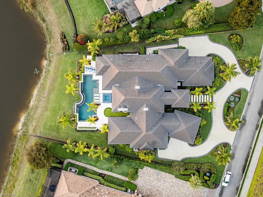 6199 Highcroft Drive Naples, FL 34119 - Photo 44 of 45 Aerial view of the house and proximity to oversized pond behind it.