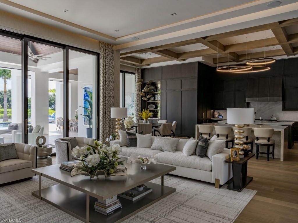 6199 Highcroft Drive Naples, FL 34119 - Photo 5 of 45 Living room with coffered ceiling and light wood-type flooring