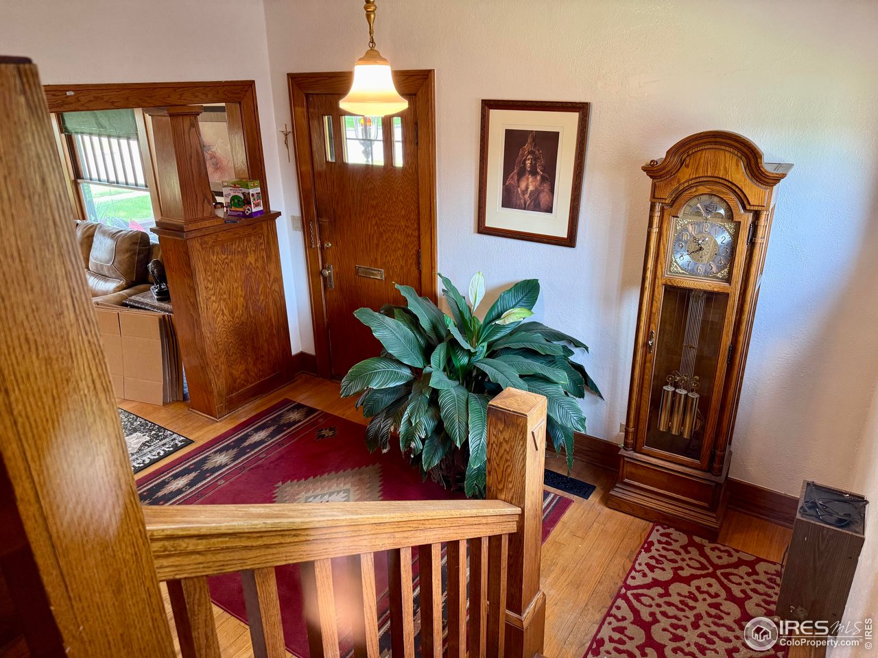 406 South Morlan Avenue Holyoke, CO 80734 - Photo 2 of 38 a view of front door with chair and wooden floor