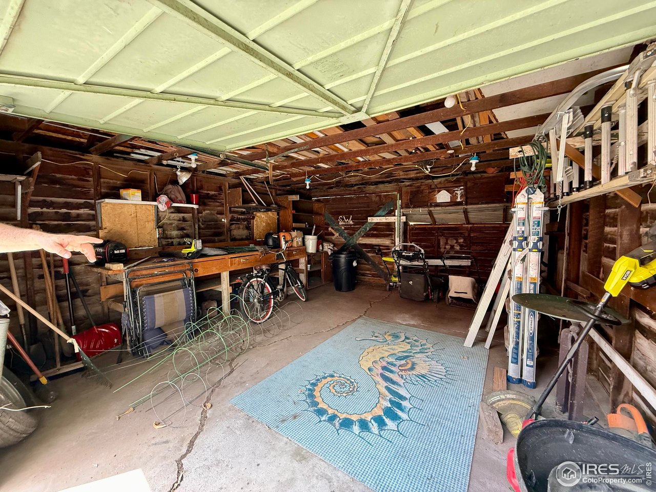 406 South Morlan Avenue Holyoke, CO 80734 - Photo 33 of 38 a view of a garage with storage