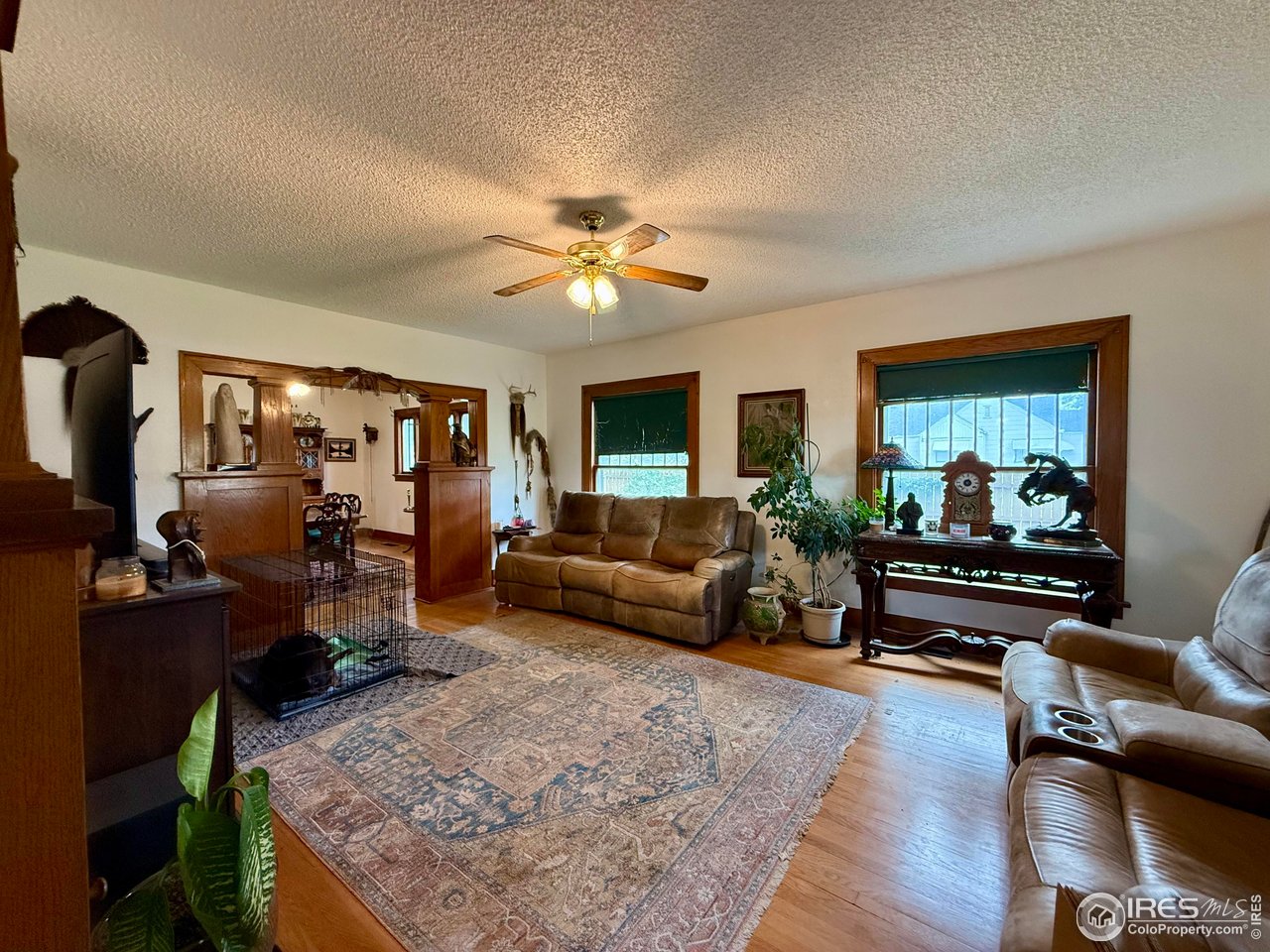406 South Morlan Avenue Holyoke, CO 80734 - Photo 4 of 38 a living room with furniture and a flat screen tv