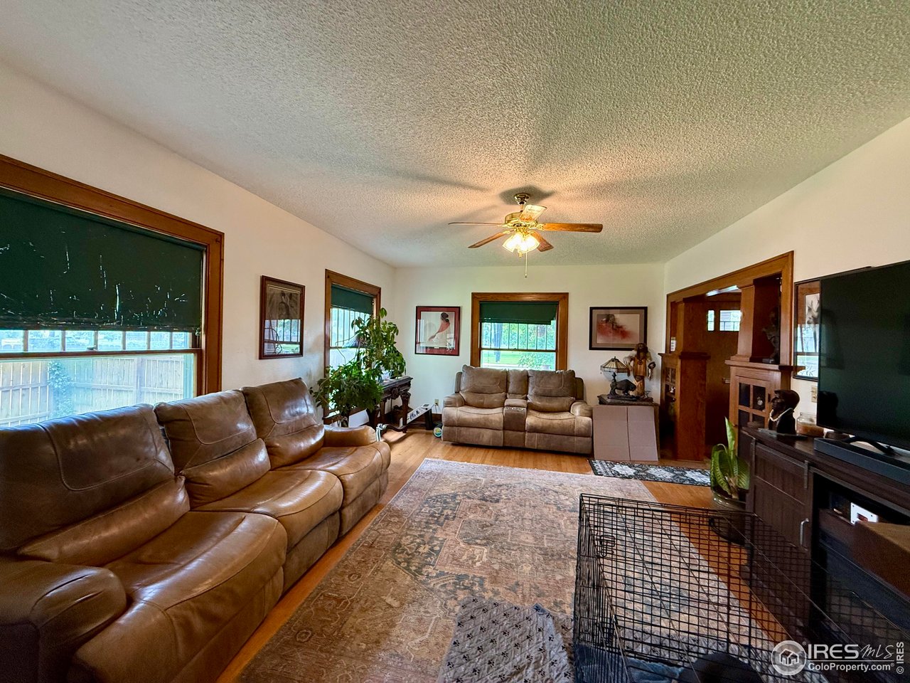 406 South Morlan Avenue Holyoke, CO 80734 - Photo 5 of 38 a living room with furniture and a flat screen tv