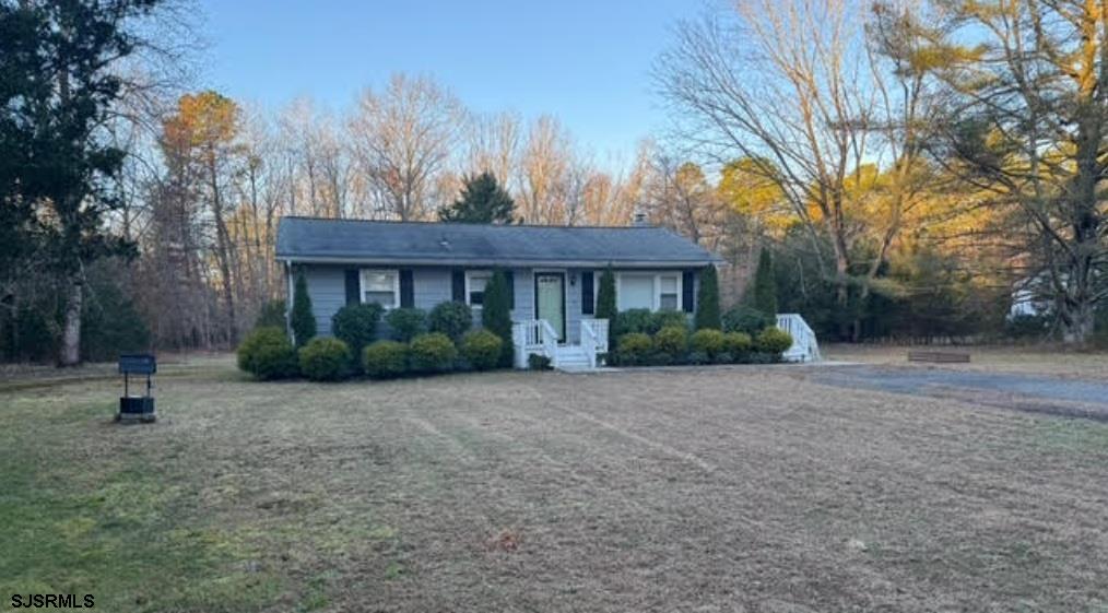 a view of a house with a street