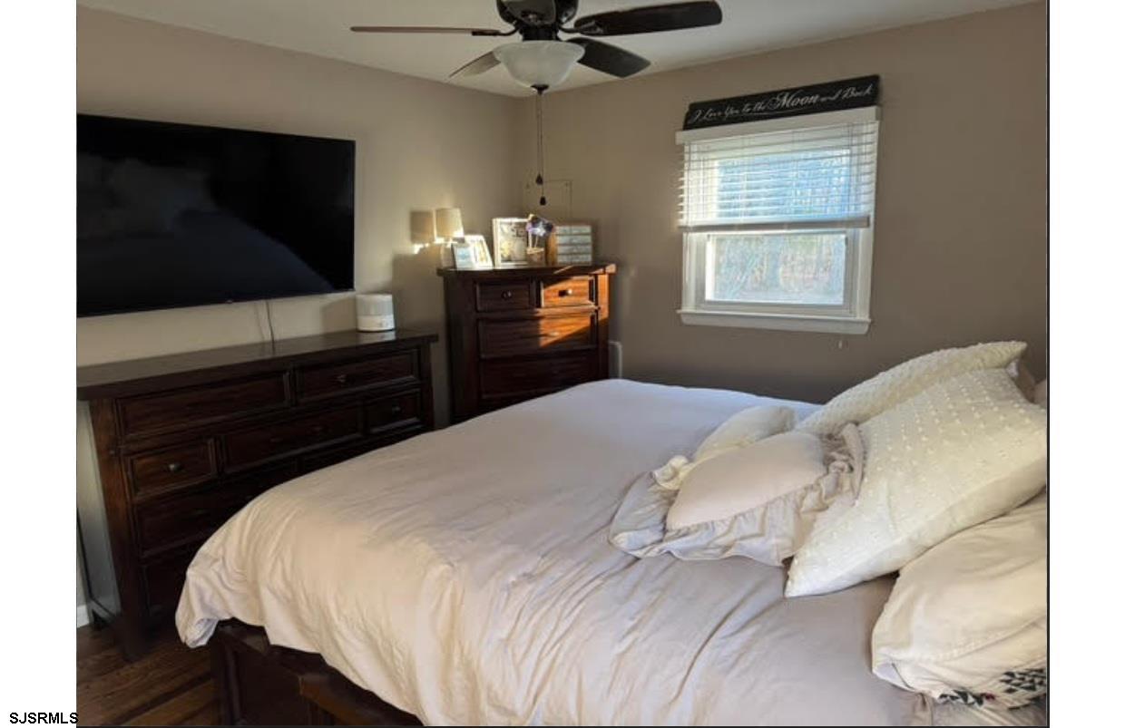 6936 Casale Boulevard Mays Landing, NJ 08330 - Photo 6 of 9 a bedroom with a bed and a flat screen tv