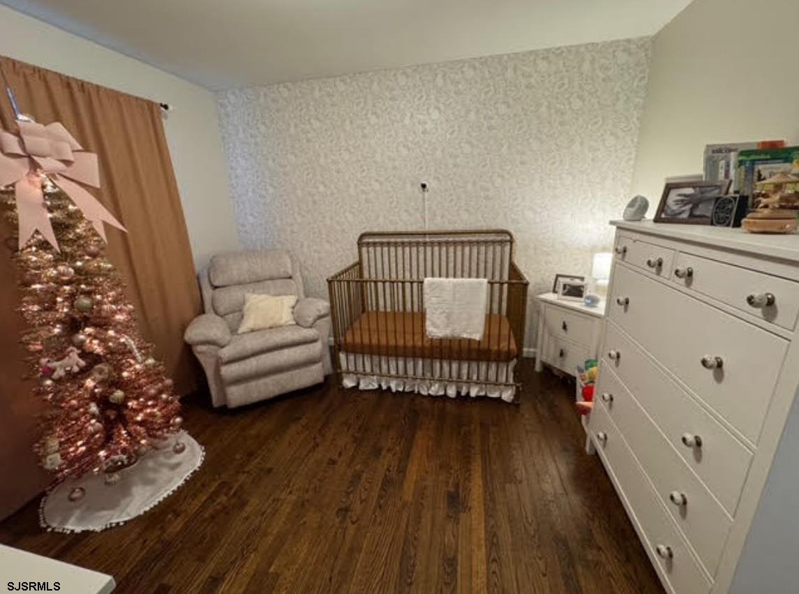 6936 Casale Boulevard Mays Landing, NJ 08330 - Photo 8 of 9 a bedroom with furniture and a baby crib