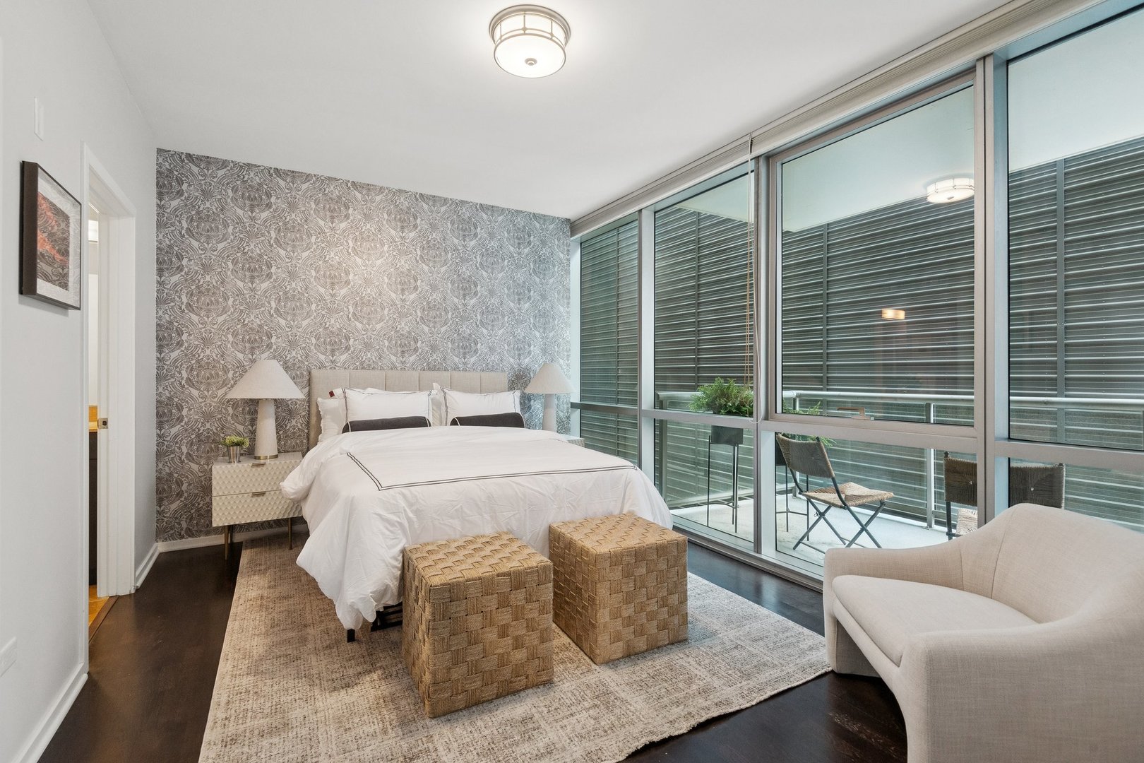 125 South Green Street, Unit 308A Chicago, IL 60607 - Photo 11 of 24 a bedroom with a bed and glass window