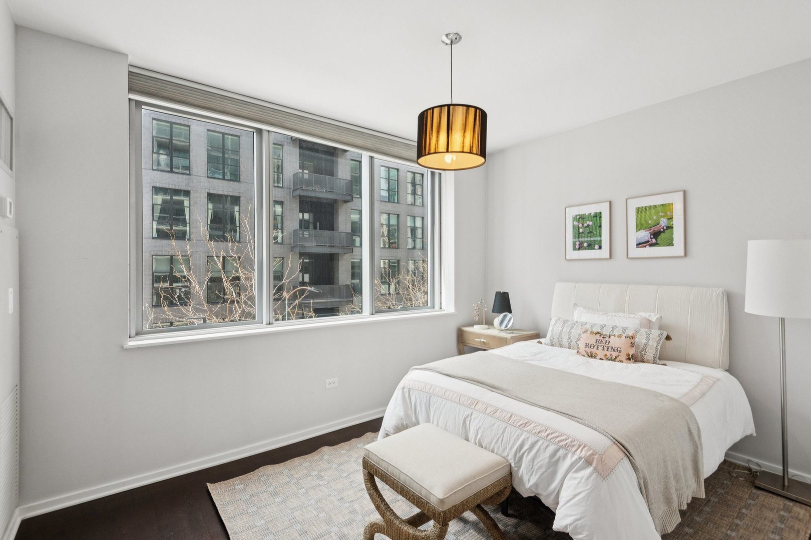 125 South Green Street, Unit 308A Chicago, IL 60607 - Photo 16 of 24 a bedroom with a bed and a window