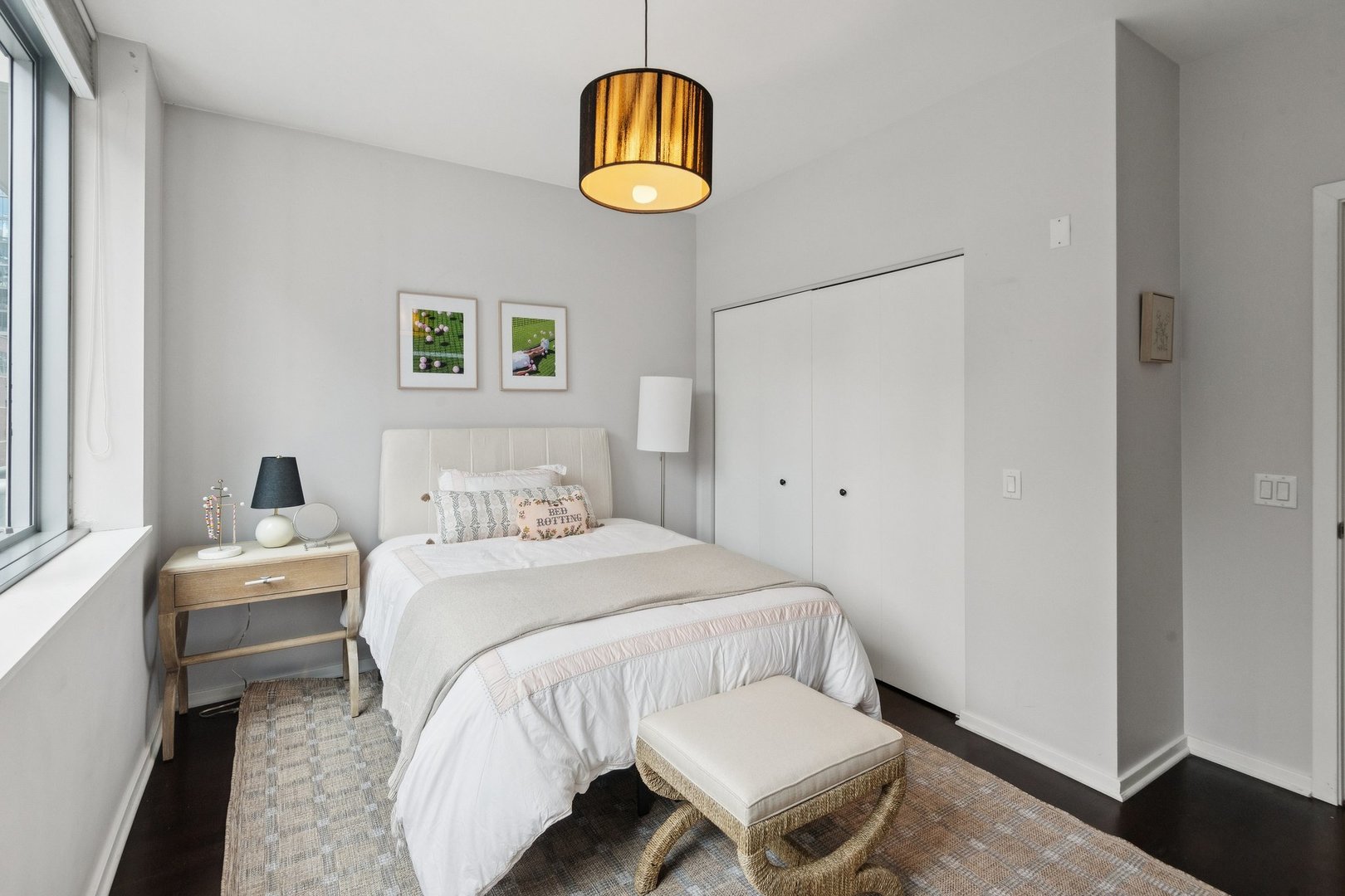 125 South Green Street, Unit 308A Chicago, IL 60607 - Photo 17 of 24 a bedroom with a bed and a window