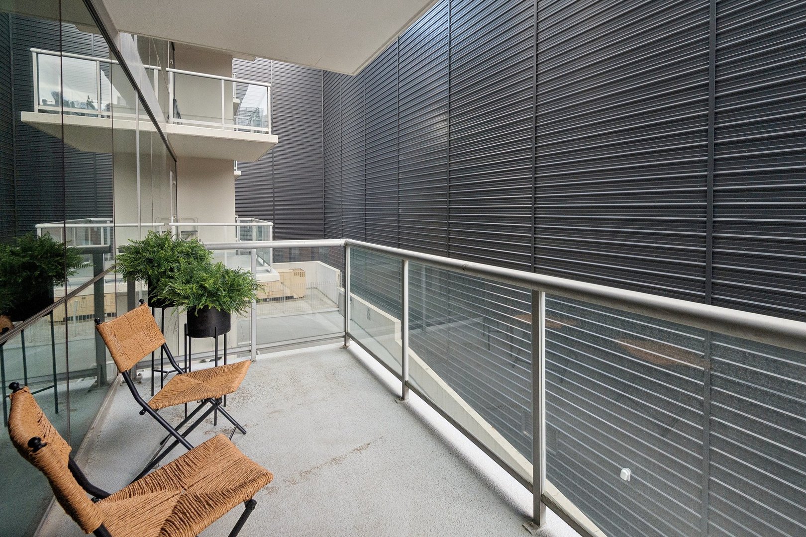 125 South Green Street, Unit 308A Chicago, IL 60607 - Photo 19 of 24 a view of a patio with table and chairs and potted plants