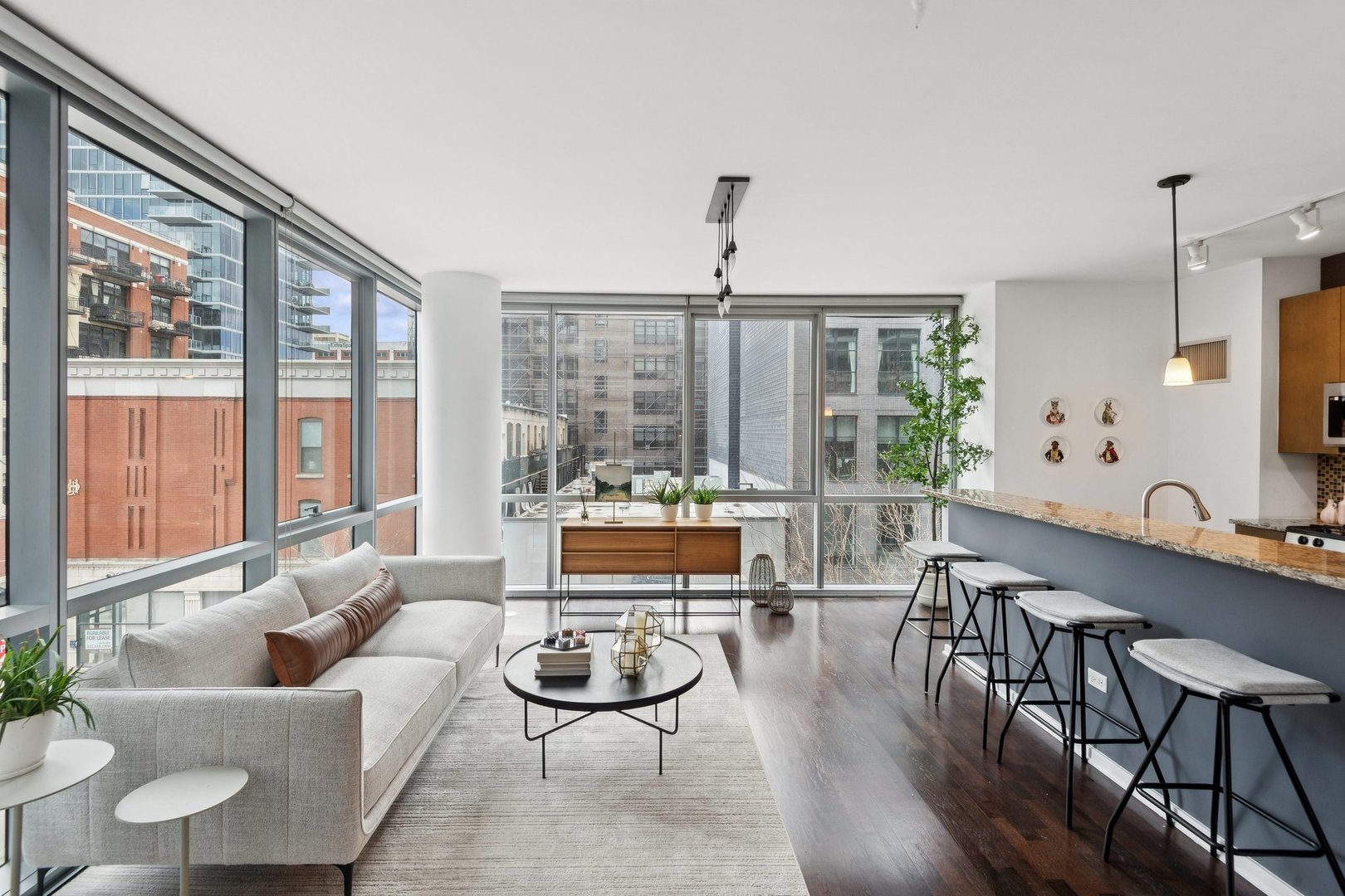 125 South Green Street, Unit 308A Chicago, IL 60607 - Photo 4 of 24 a living room with furniture and a large window