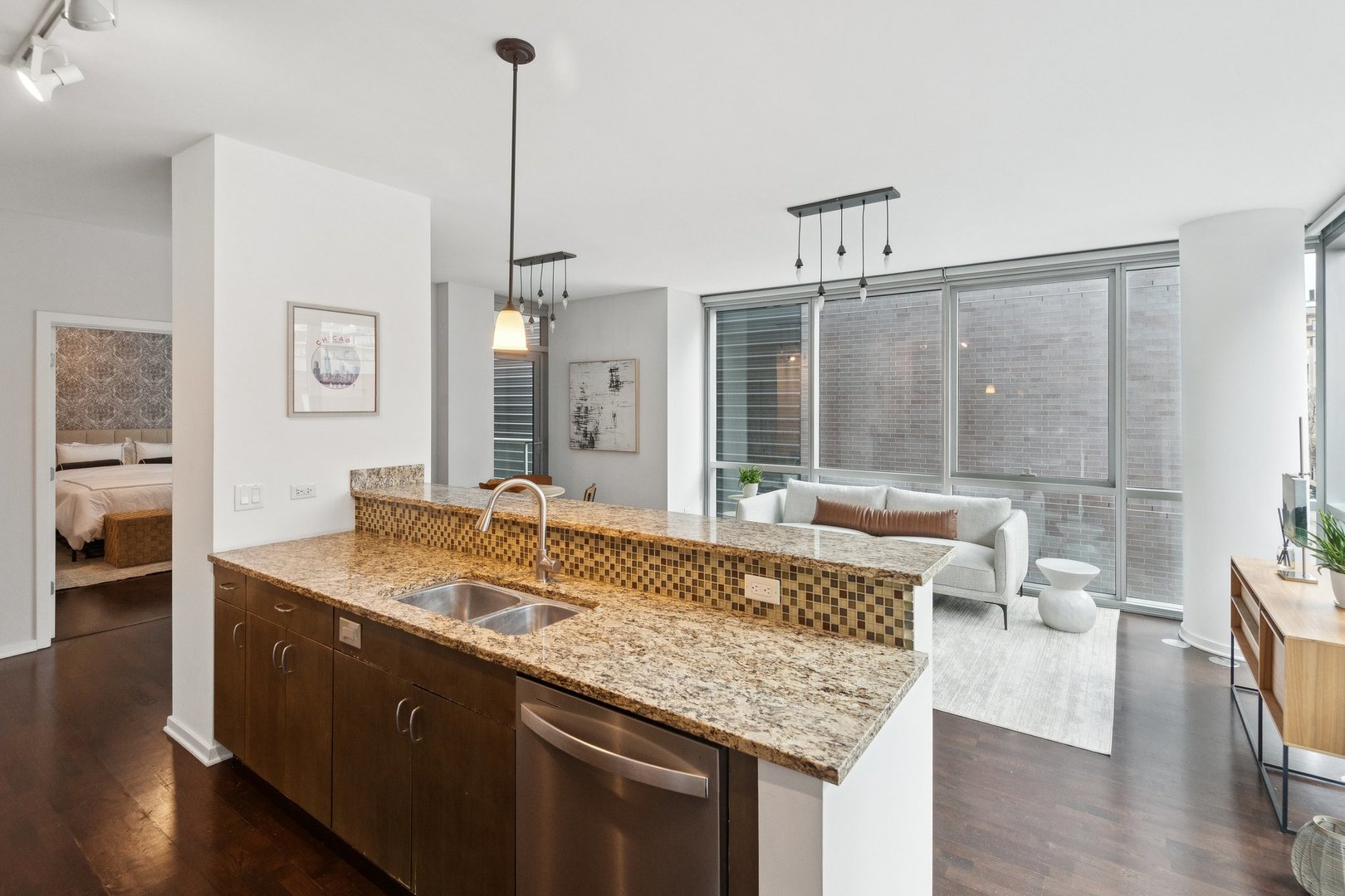 125 South Green Street, Unit 308A Chicago, IL 60607 - Photo 9 of 24 a living room with granite countertop furniture and wooden floor