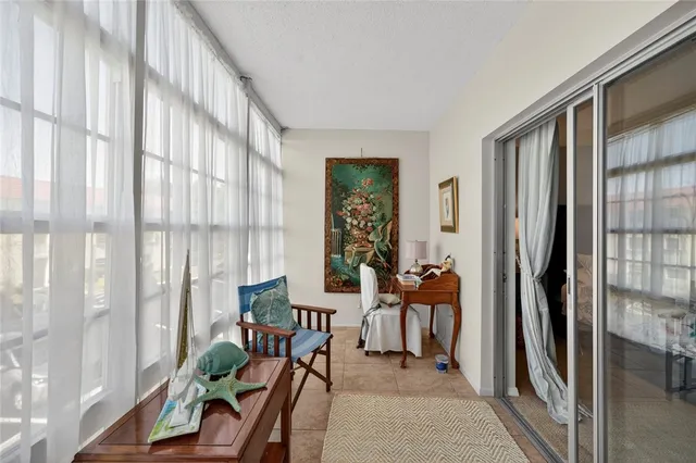 a view of a entryway with furniture and floor to ceiling window