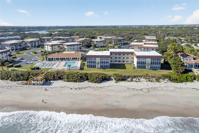 an aerial view of residential building and lake view