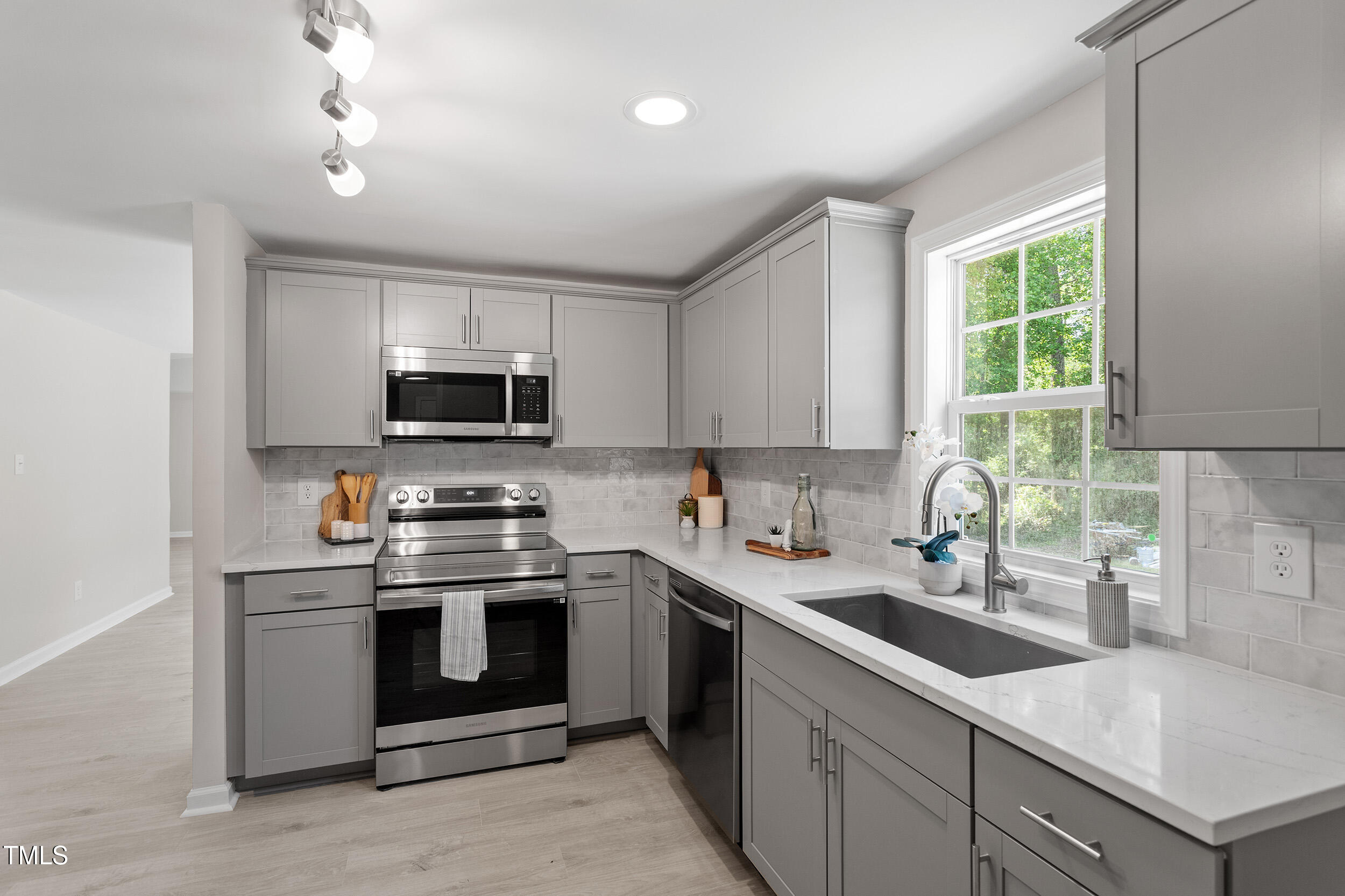 5049 West Hornes Church Road Bailey, NC 27807 - Photo 13 of 27 a kitchen with a sink stove top oven and microwave