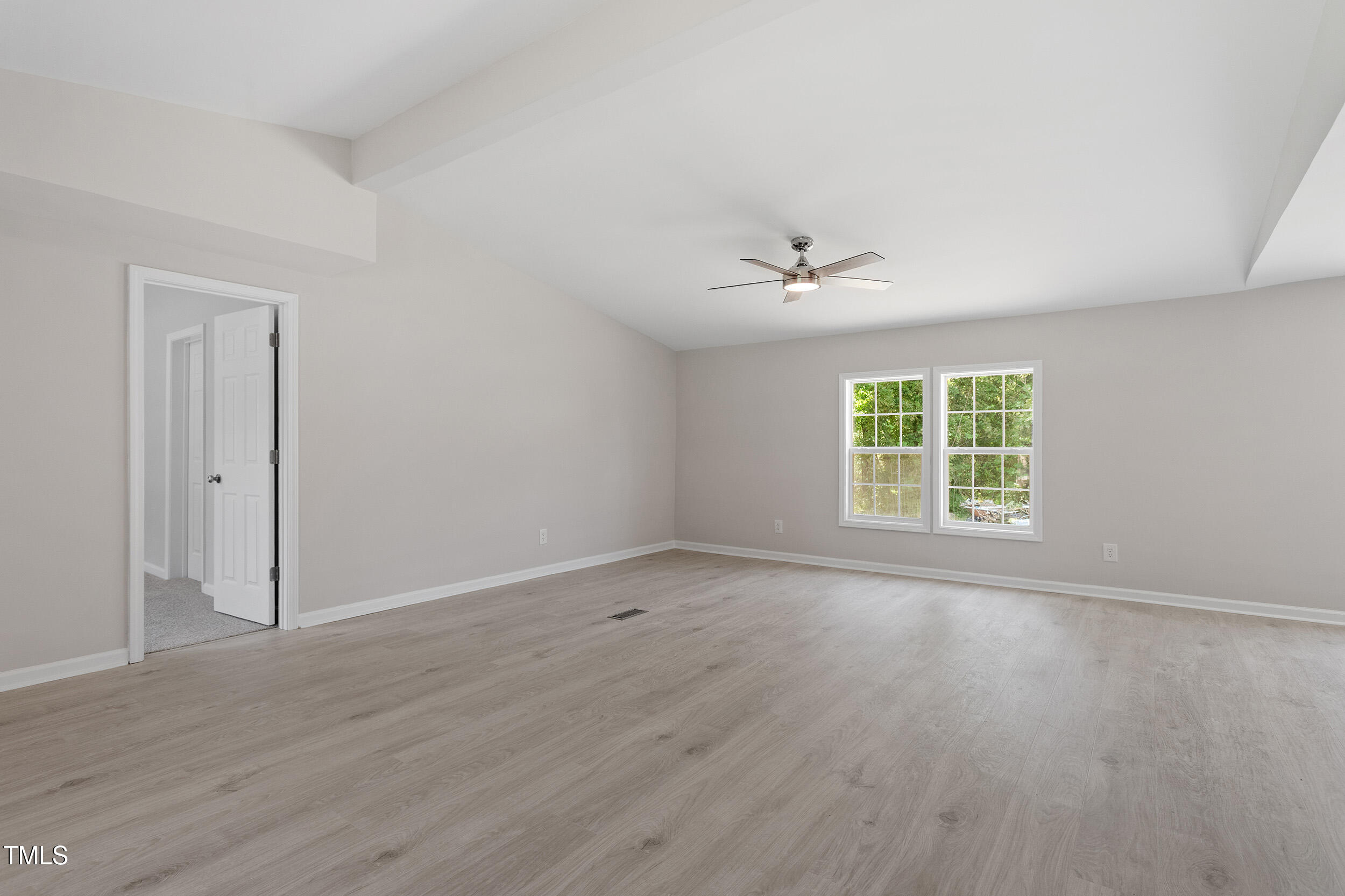 5049 West Hornes Church Road Bailey, NC 27807 - Photo 2 of 27 an empty room with wooden floor and windows