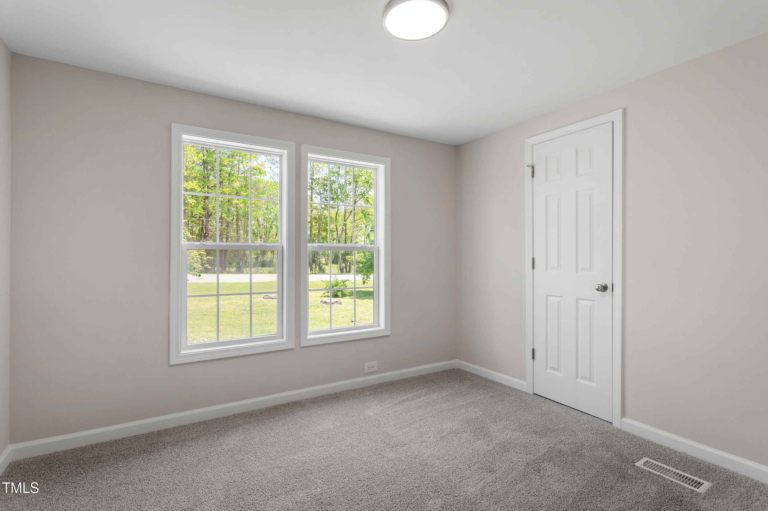 5049 West Hornes Church Road Bailey, NC 27807 - Photo 21 of 27 an empty room with windows