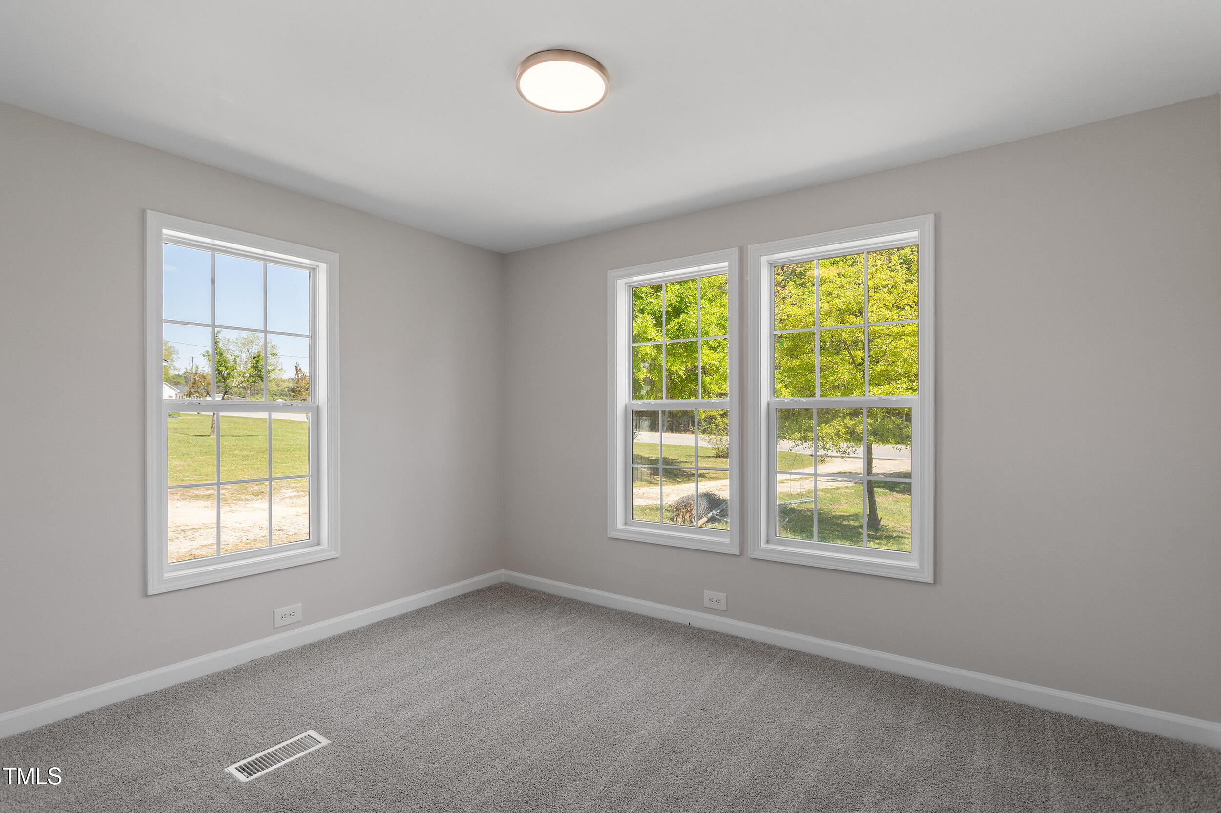5049 West Hornes Church Road Bailey, NC 27807 - Photo 22 of 27 an empty room with windows