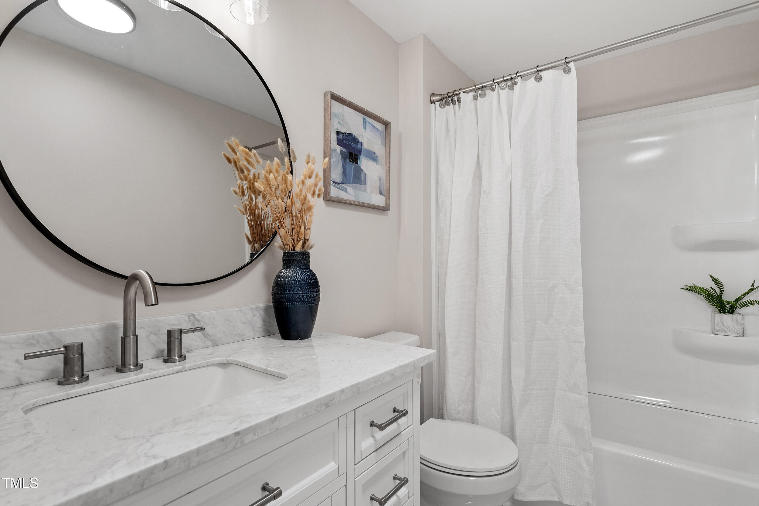 5049 West Hornes Church Road Bailey, NC 27807 - Photo 23 of 27 a bathroom with a granite countertop sink and a mirror