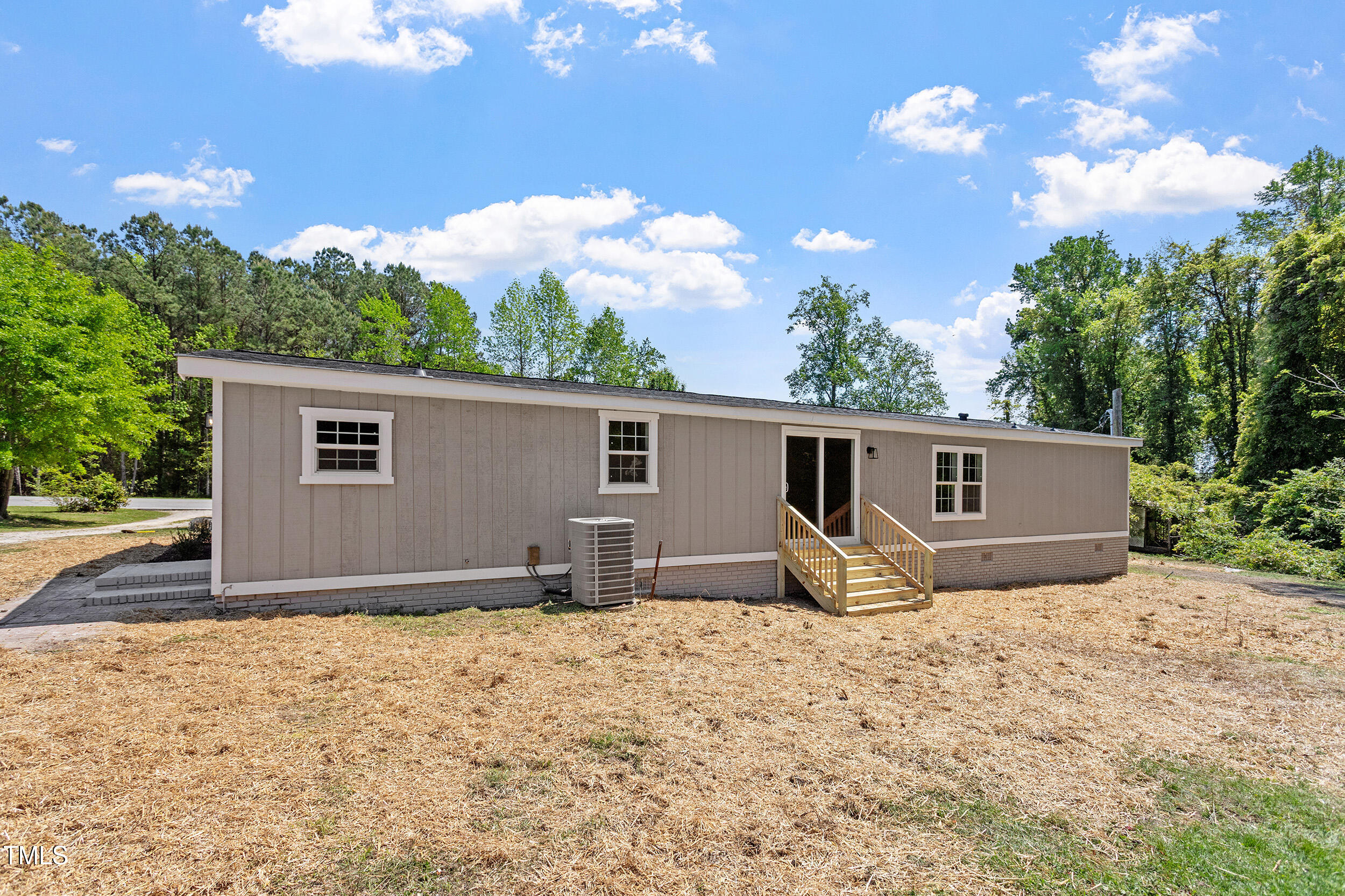 5049 West Hornes Church Road Bailey, NC 27807 - Photo 26 of 27 a house view with a backyard space