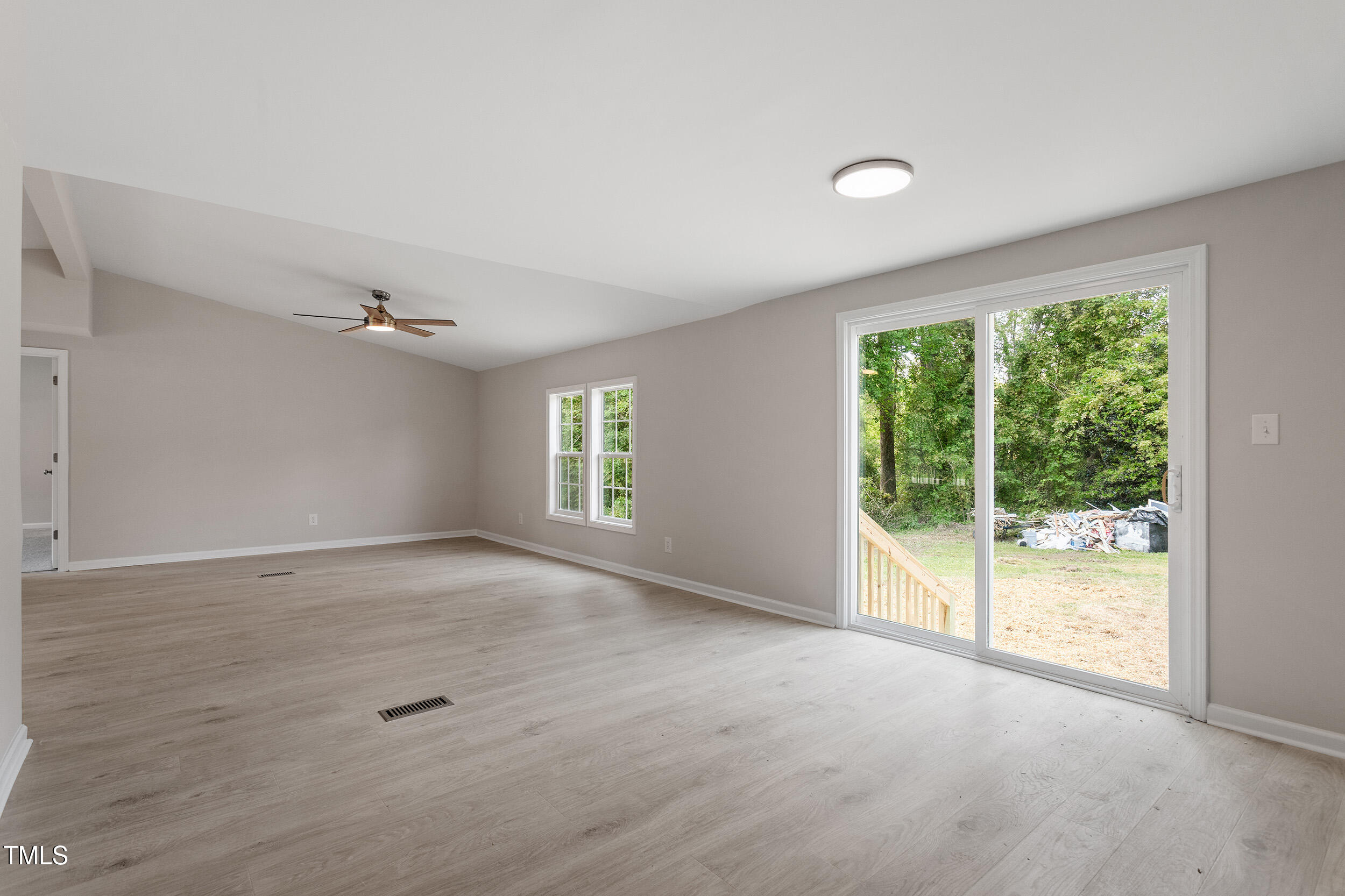 5049 West Hornes Church Road Bailey, NC 27807 - Photo 10 of 27 a view of a livingroom with a ceiling fan and window