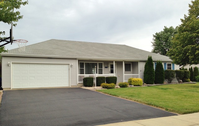 795 Amanda Road New Lenox, IL 60451 - Photo 3 of 24 a front view of a house with a garden and plants