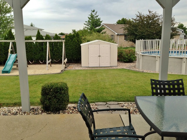 795 Amanda Road New Lenox, IL 60451 - Photo 21 of 24 a view of a backyard with sitting area
