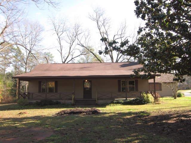 477 Kinard Mill Road, Unit A Jackson, GA 30233 - Photo 1 of 1 a front view of a house with a yard