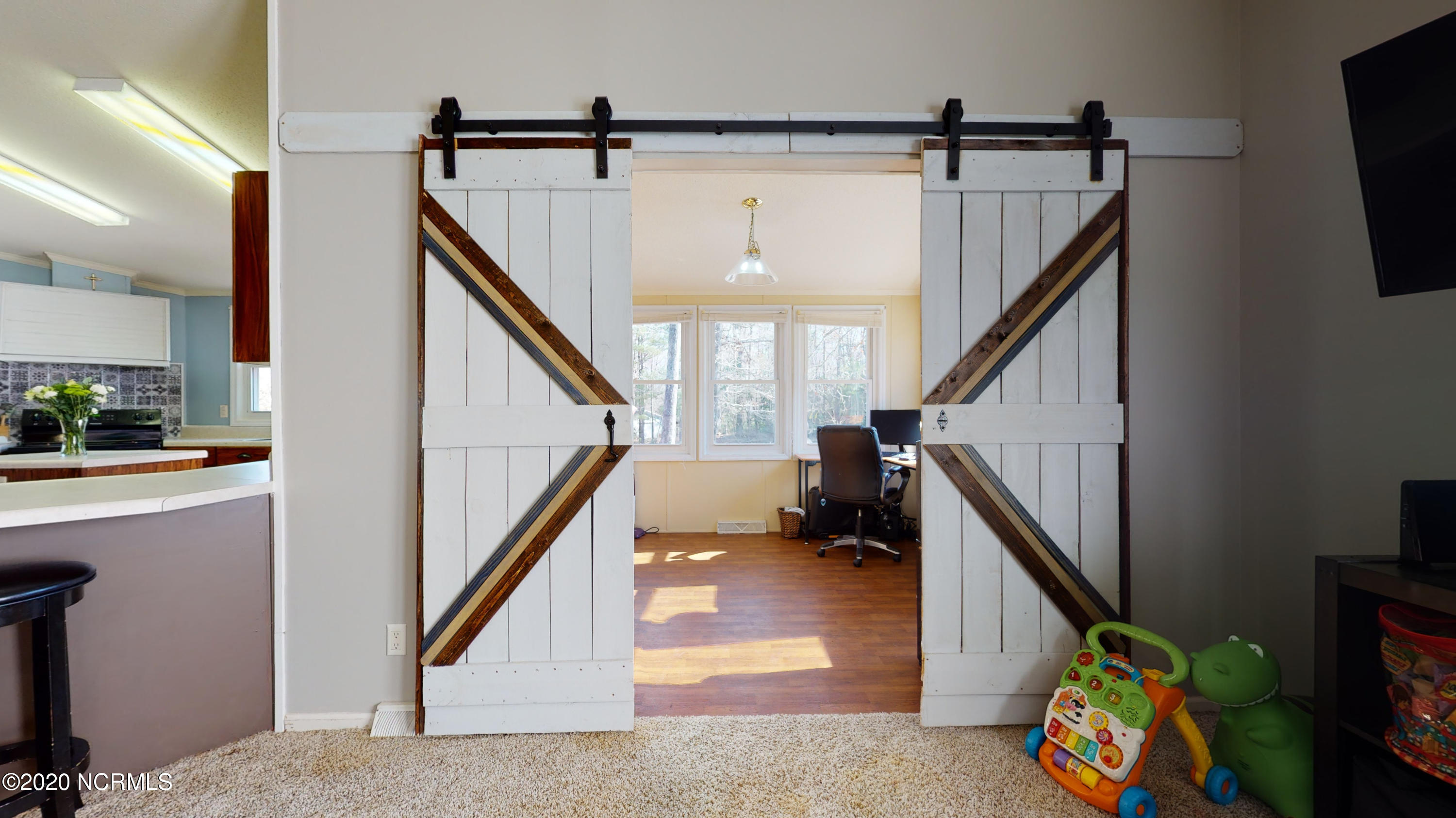 212 Newbold Road Jacksonville, NC 28540 - Photo 11 of 19 Barn Doors to SunRoom