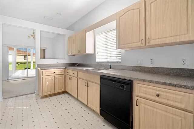 a kitchen with stainless steel appliances granite countertop a stove a microwave and a refrigerator