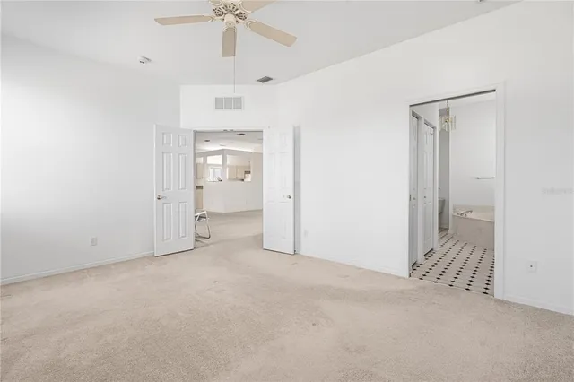a bathroom with a sink a bathtub a mirror a vanity and a shower