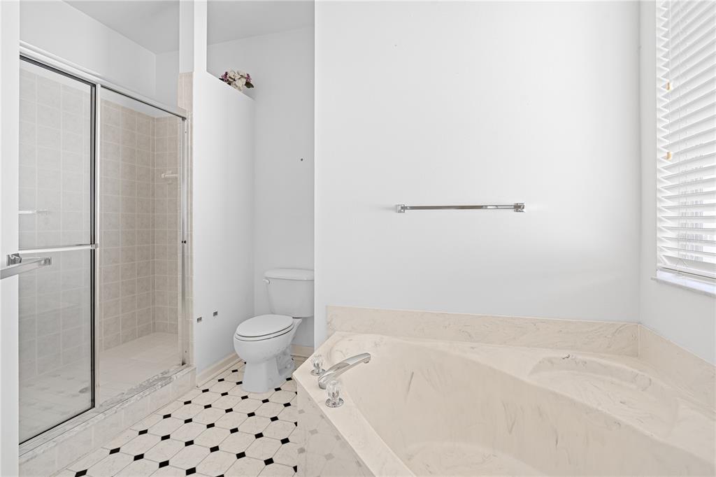 2459 Northwest 55th Avenue Road Ocala, FL 34482 - Photo 20 of 38 a bathroom with a toilet and a shower